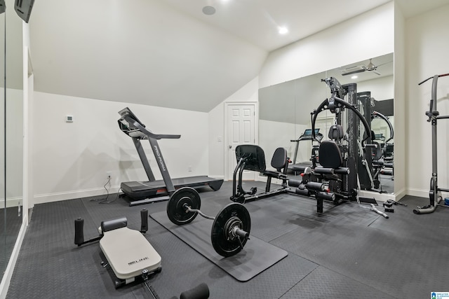 exercise area with baseboards and vaulted ceiling