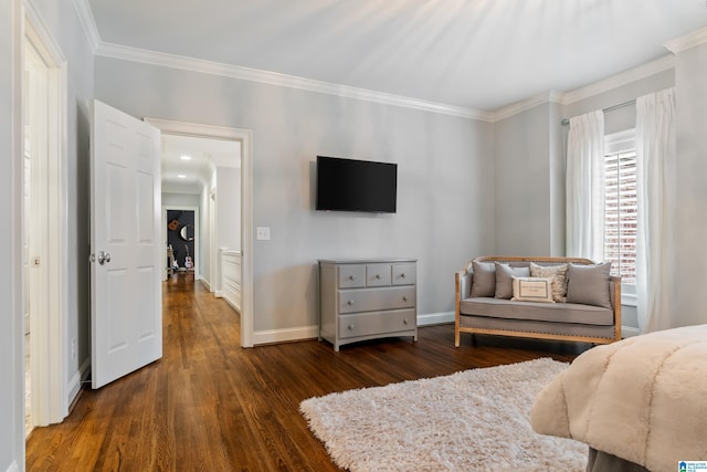 bedroom featuring ornamental molding, dark wood-style flooring, and baseboards