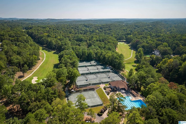 drone / aerial view featuring a view of trees