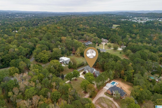 drone / aerial view with a view of trees