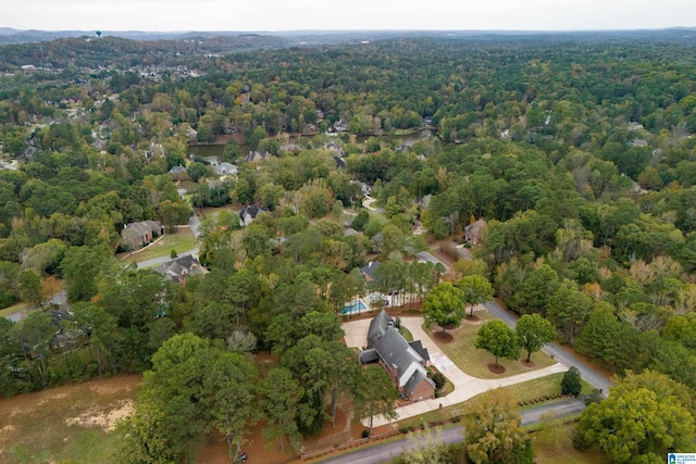 birds eye view of property with a forest view