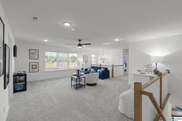 living room with light carpet and ceiling fan