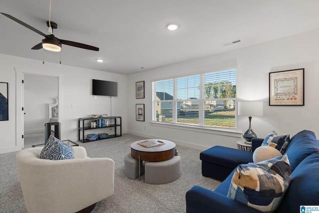 living room with carpet flooring and ceiling fan