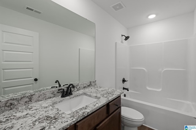 full bathroom featuring vanity, toilet, and bathtub / shower combination