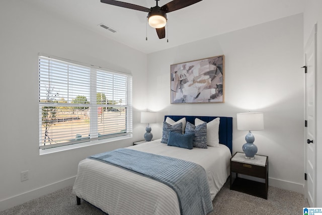 carpeted bedroom with ceiling fan