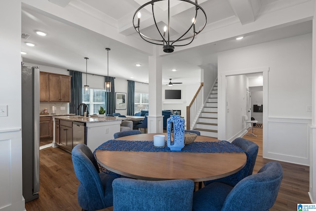 dining space featuring crown molding, dark hardwood / wood-style floors, beamed ceiling, and ceiling fan with notable chandelier