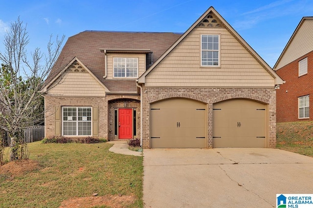 view of front of house with a front lawn and a garage