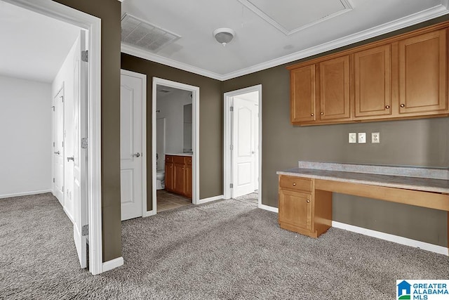 unfurnished office featuring crown molding and light colored carpet