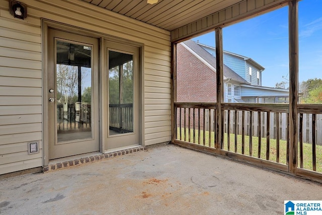 unfurnished sunroom featuring wood ceiling and a healthy amount of sunlight