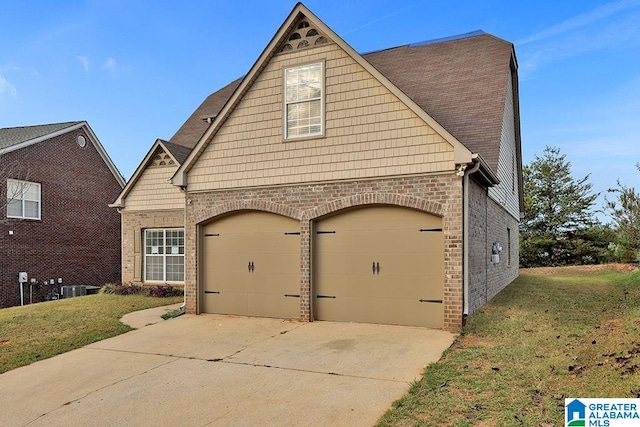 view of front of home with a front lawn and central AC