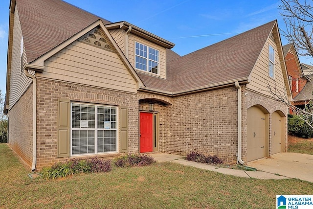 view of front of house with a front yard and a garage