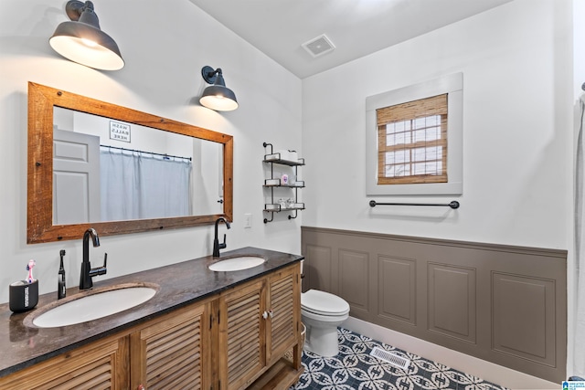 bathroom with vanity and toilet