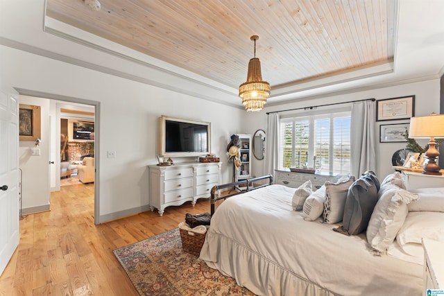 bedroom with a raised ceiling, light hardwood / wood-style floors, wooden ceiling, crown molding, and an inviting chandelier