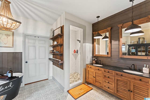 bathroom featuring vanity, shower with separate bathtub, and wooden walls