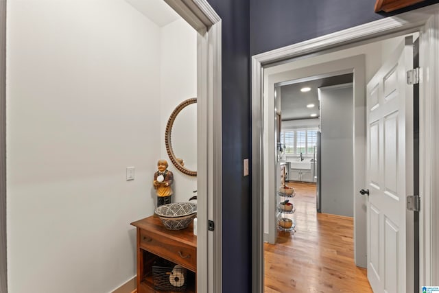 hall with light hardwood / wood-style floors