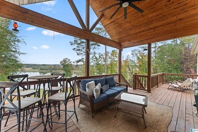 wooden deck featuring a water view and ceiling fan