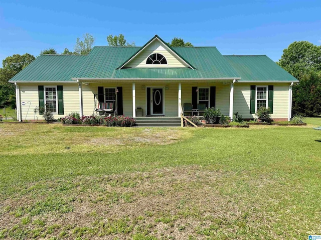 view of front of house featuring a front yard and covered porch