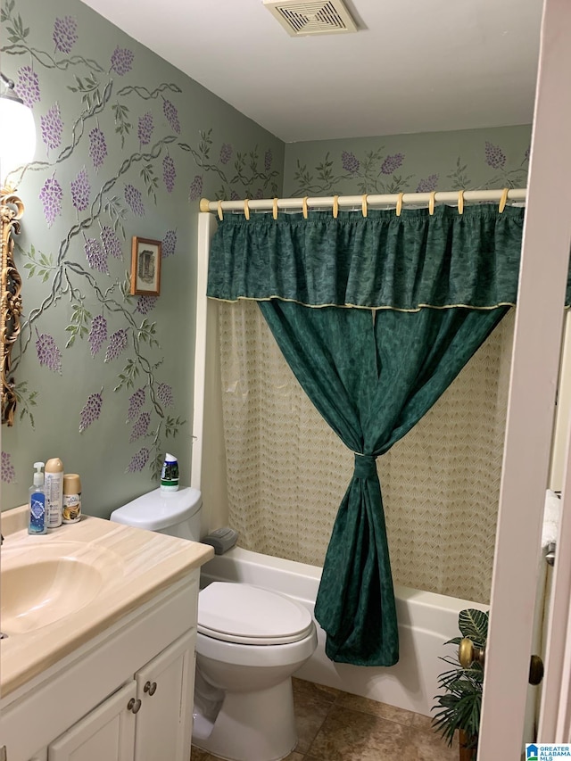 full bathroom with vanity, shower / tub combo with curtain, toilet, and tile patterned floors