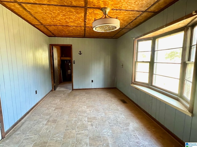 empty room with wooden walls