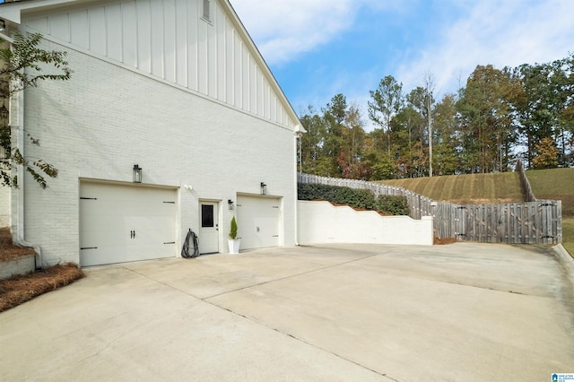 view of property exterior featuring a garage