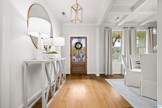 foyer with beam ceiling, coffered ceiling, ornamental molding, and hardwood / wood-style floors