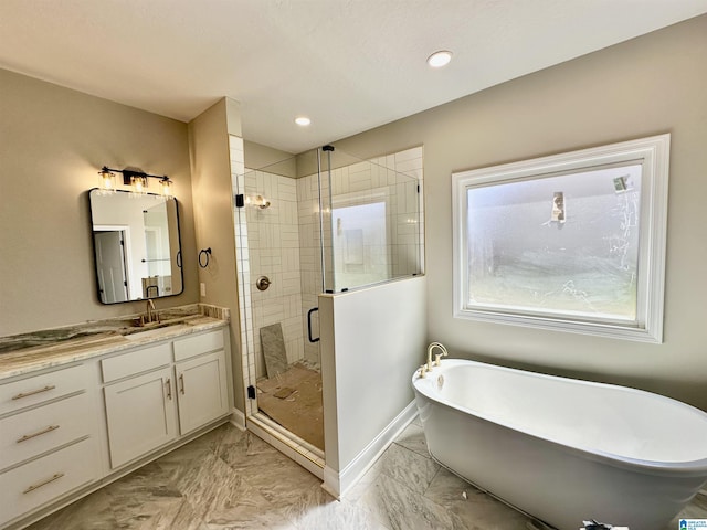 bathroom featuring baseboards, a freestanding tub, vanity, marble finish floor, and a stall shower