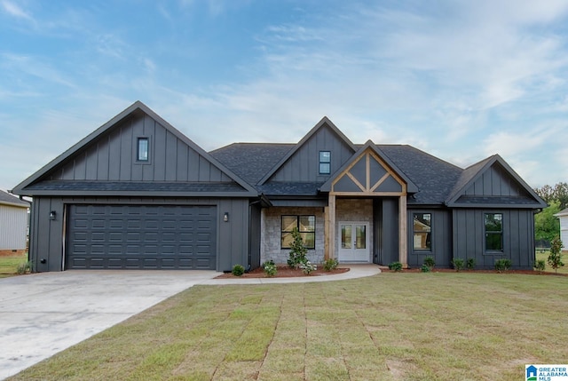 view of front facade with a front lawn and a garage