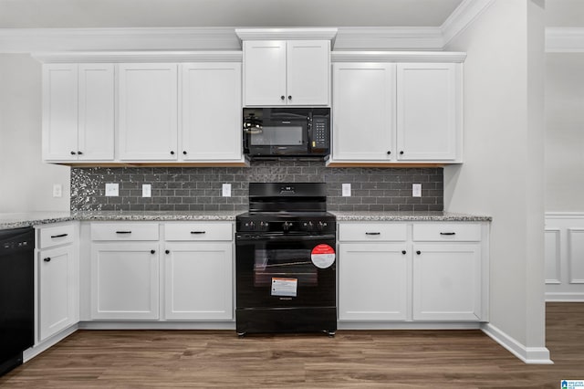 kitchen with dark wood-type flooring, white cabinets, and black appliances