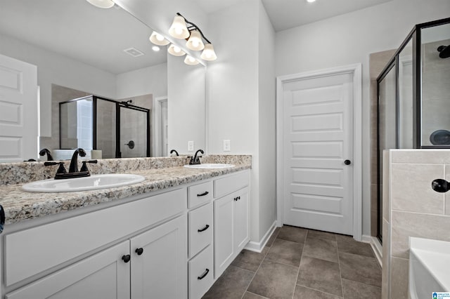 bathroom featuring tile patterned floors, vanity, and independent shower and bath