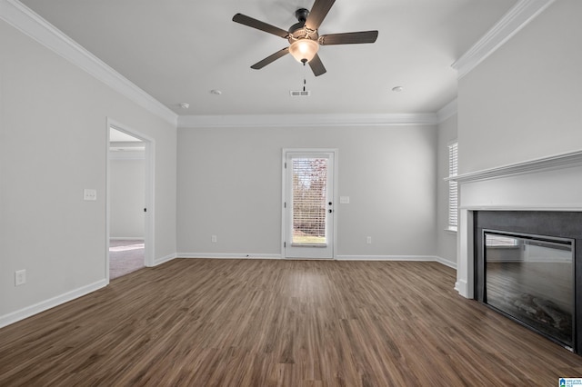 unfurnished living room featuring dark hardwood / wood-style floors, ceiling fan, and crown molding