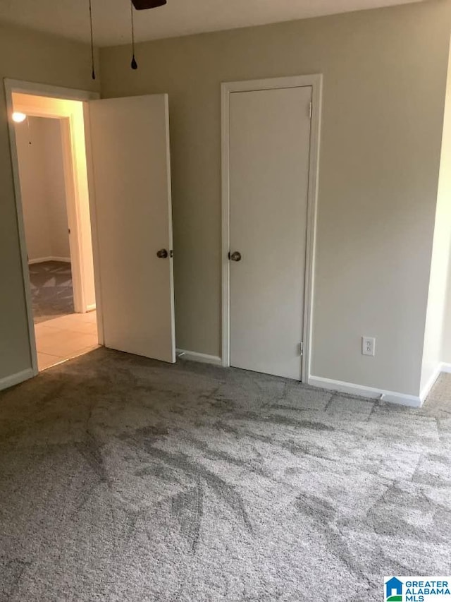 unfurnished bedroom featuring carpet