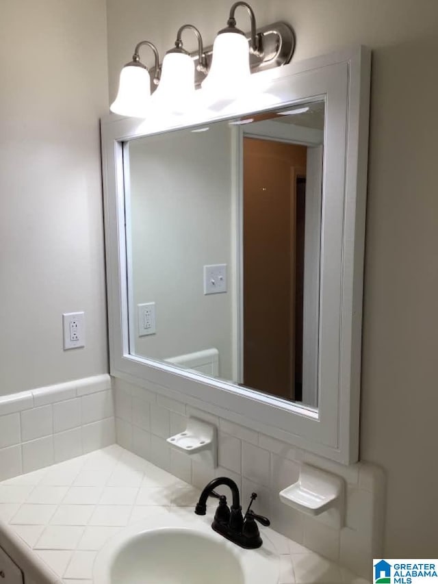 bathroom with vanity and backsplash