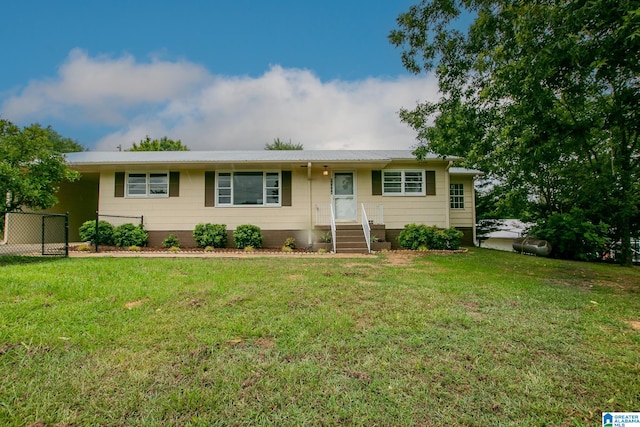 ranch-style home with a front yard