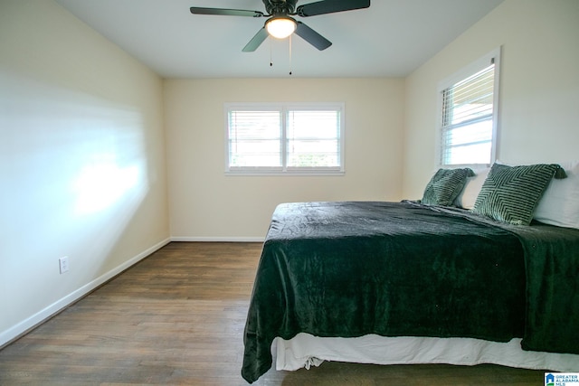 bedroom with wood-type flooring and ceiling fan