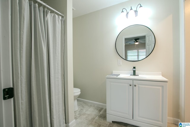 bathroom featuring vanity, tile patterned floors, toilet, and ceiling fan