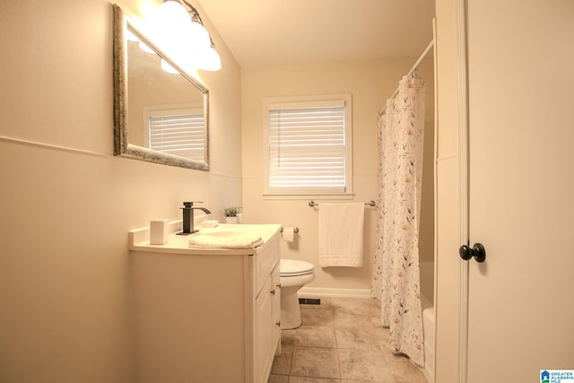 full bathroom featuring toilet, vanity, and shower / bathtub combination with curtain