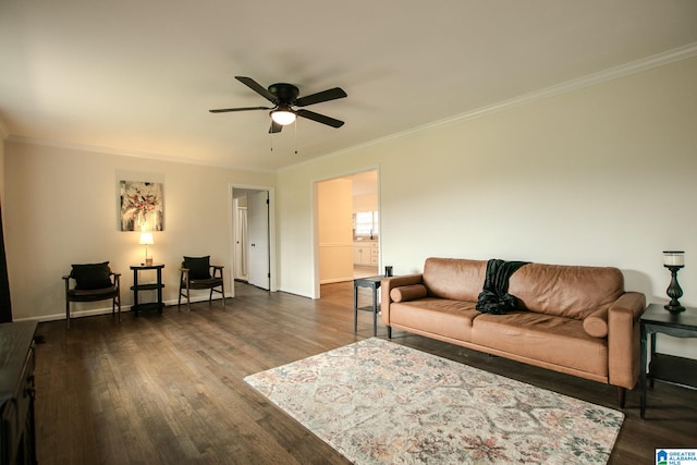 living room featuring dark wood-type flooring, crown molding, and ceiling fan