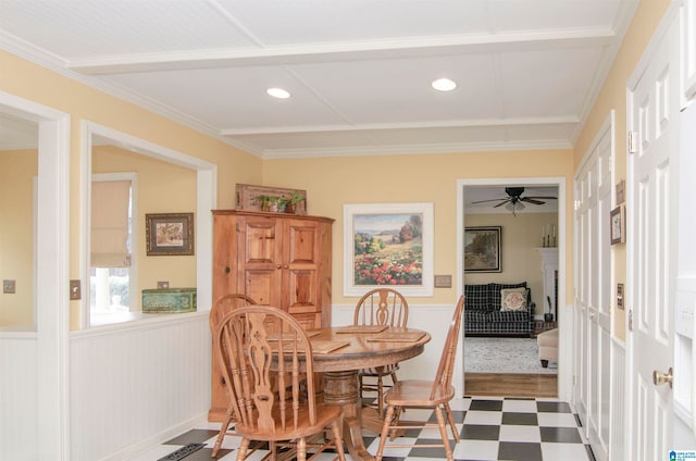 dining space with ceiling fan, ornamental molding, and dark hardwood / wood-style floors