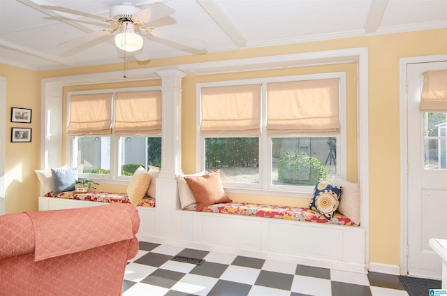 sunroom / solarium with decorative columns and ceiling fan