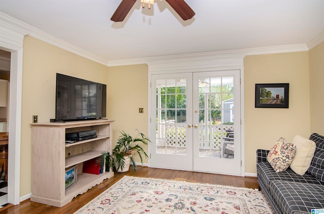 living room featuring french doors, crown molding, hardwood / wood-style flooring, and ceiling fan