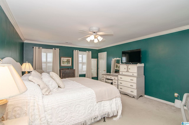 bedroom featuring ceiling fan, crown molding, and light carpet