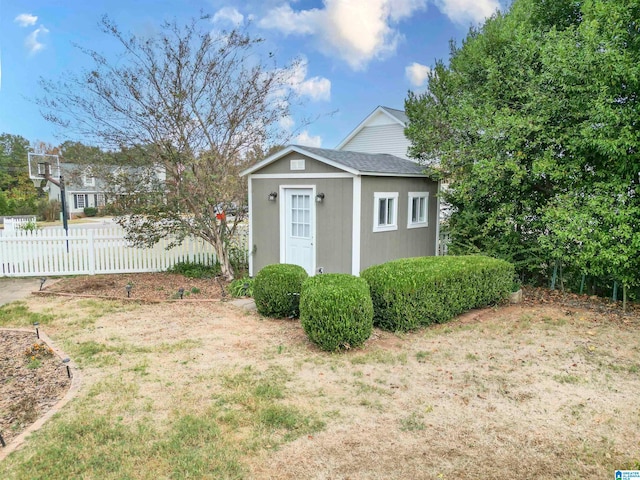 view of outbuilding featuring a yard