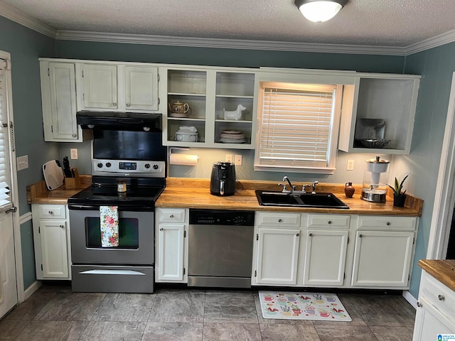 kitchen with ornamental molding, sink, stainless steel appliances, and a textured ceiling