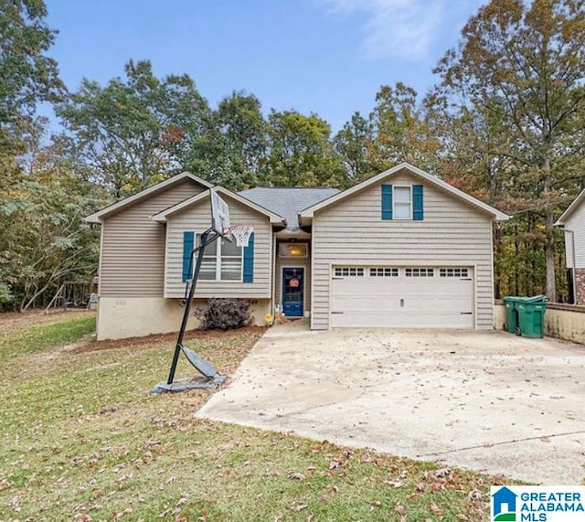 view of front of home with a front lawn and a garage