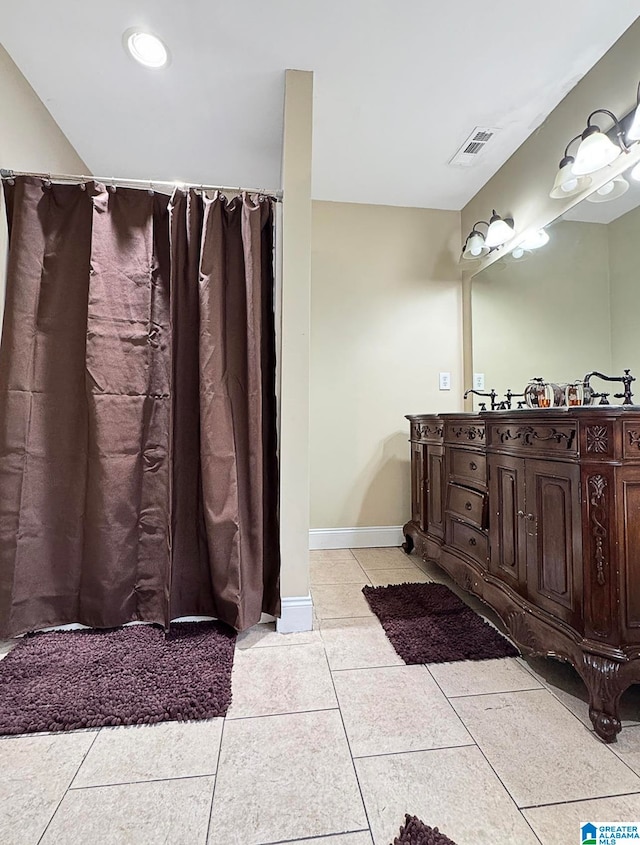 bathroom with vanity and tile patterned floors