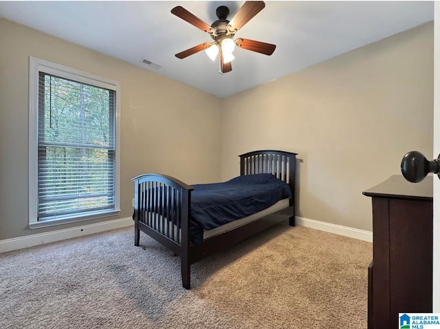 carpeted bedroom with ceiling fan