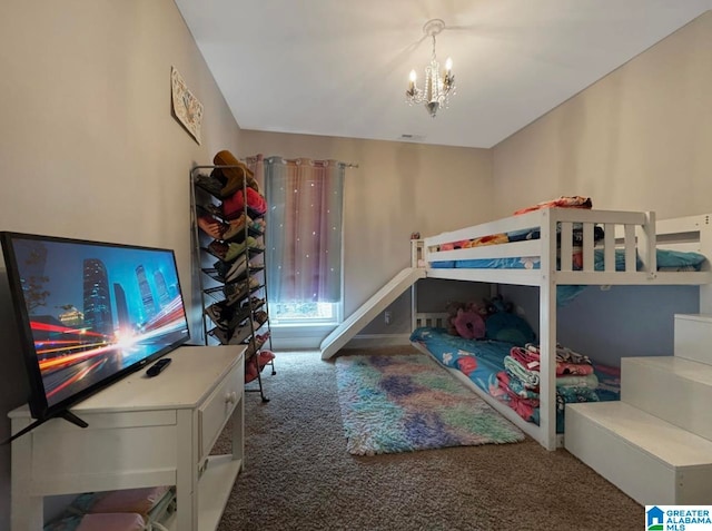 carpeted bedroom with a notable chandelier