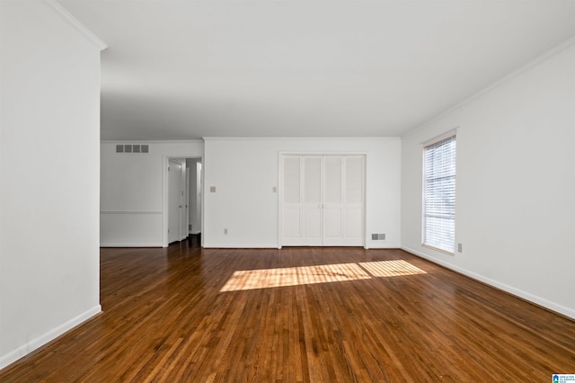 unfurnished room featuring crown molding and dark hardwood / wood-style floors