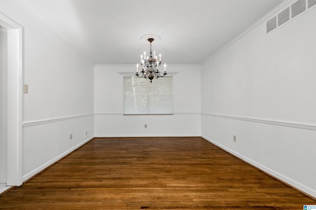 unfurnished dining area featuring ornamental molding, a chandelier, and dark wood-type flooring