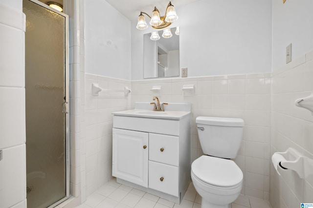 bathroom featuring tile walls, vanity, toilet, and walk in shower